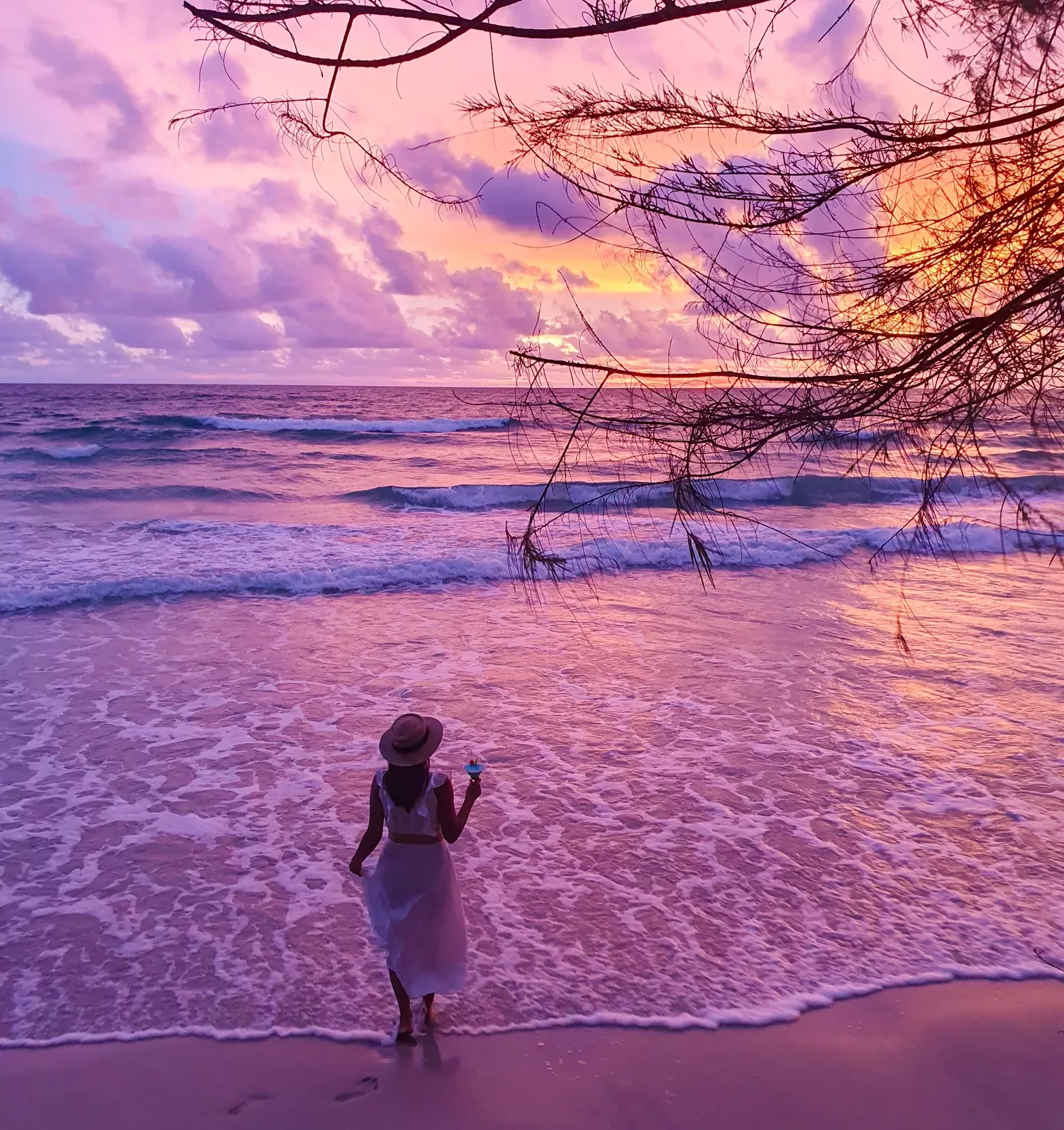 A tranquil sunset walk along the shoreline with soft waves and vibrant colors at the beach Thailand